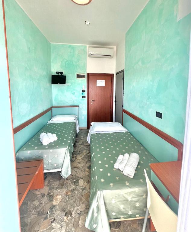 Postel nebo postele na pokoji v ubytování Hotel Vernel