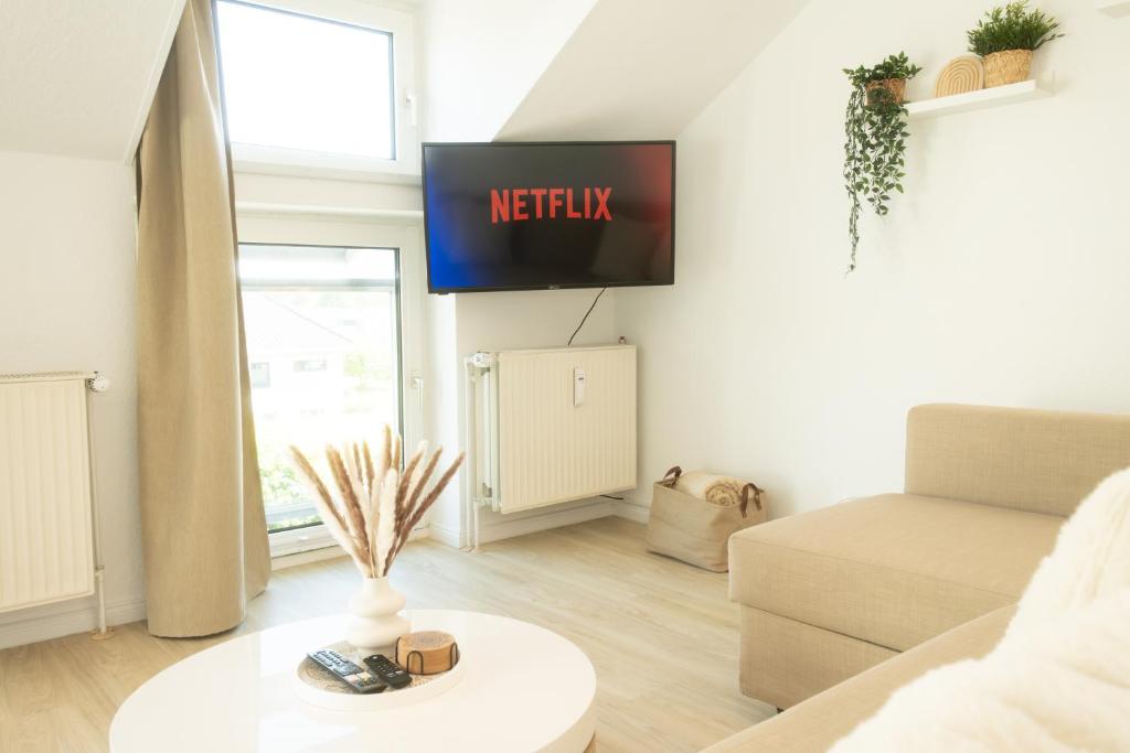 TV a/nebo společenská místnost v ubytování Ostseesonne Lichtblick