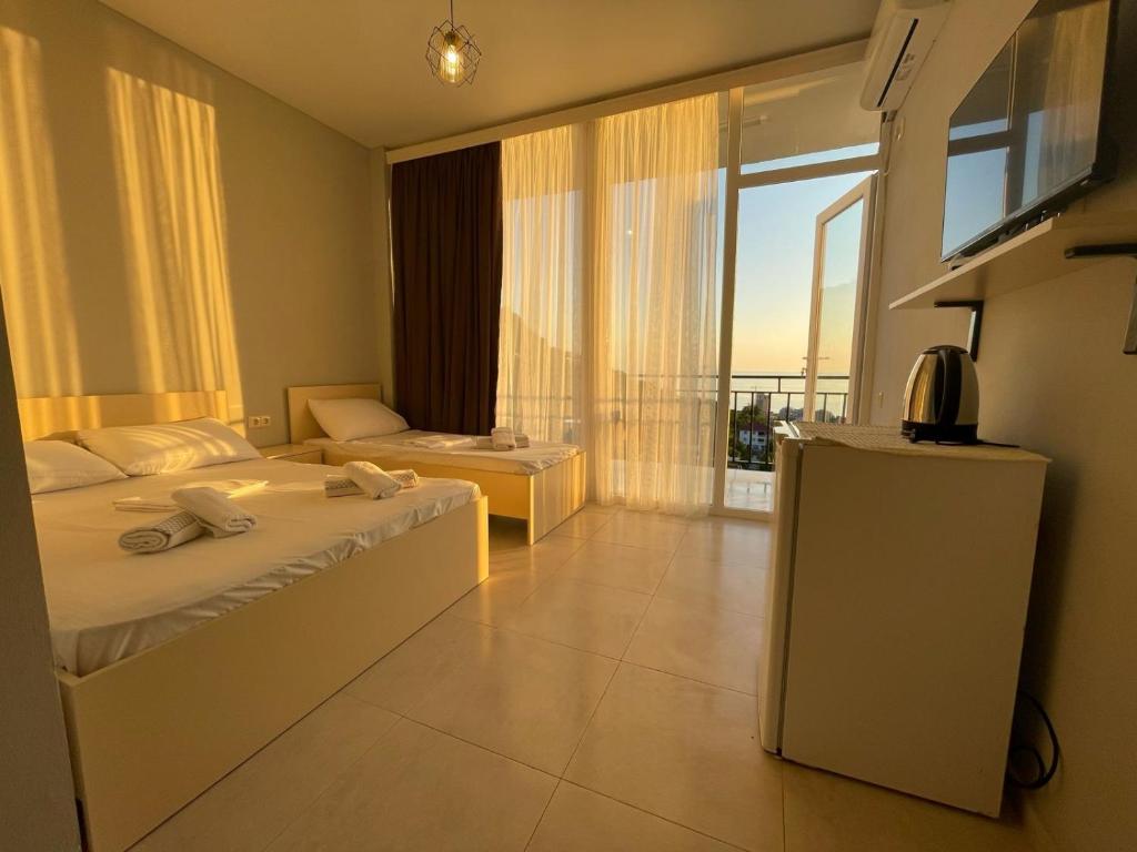 Postel nebo postele na pokoji v ubytování Hotel Nikolas