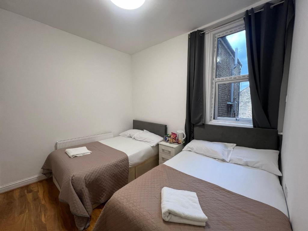 Postel nebo postele na pokoji v ubytování World Hotel