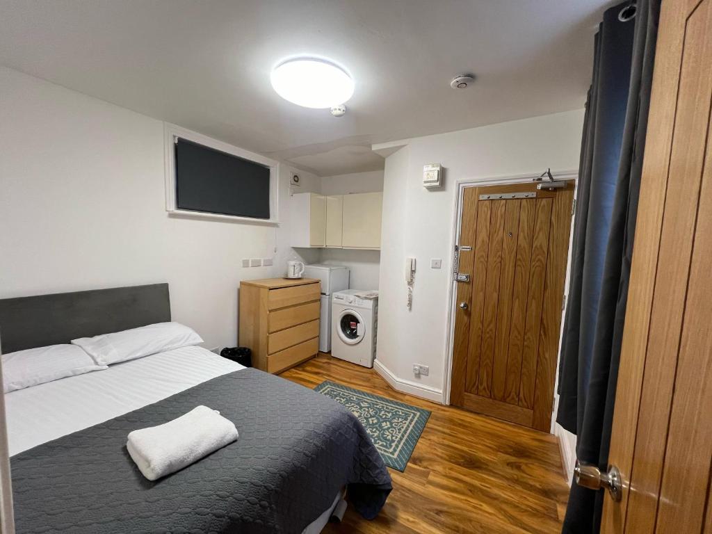 Postel nebo postele na pokoji v ubytování World Hotel