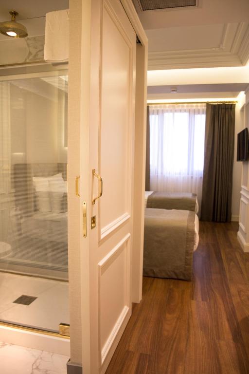 Postel nebo postele na pokoji v ubytování Mina Hotel - Special Category