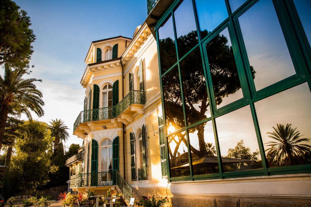 a large building with a large window in front of it at Villa Sylva & Spa in Sanremo