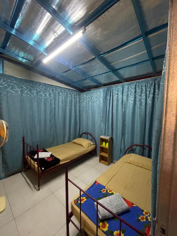 Postel nebo postele na pokoji v ubytování Memory Lane Tioman