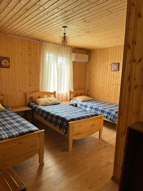 Postel nebo postele na pokoji v ubytování Guesthouse SANIKO