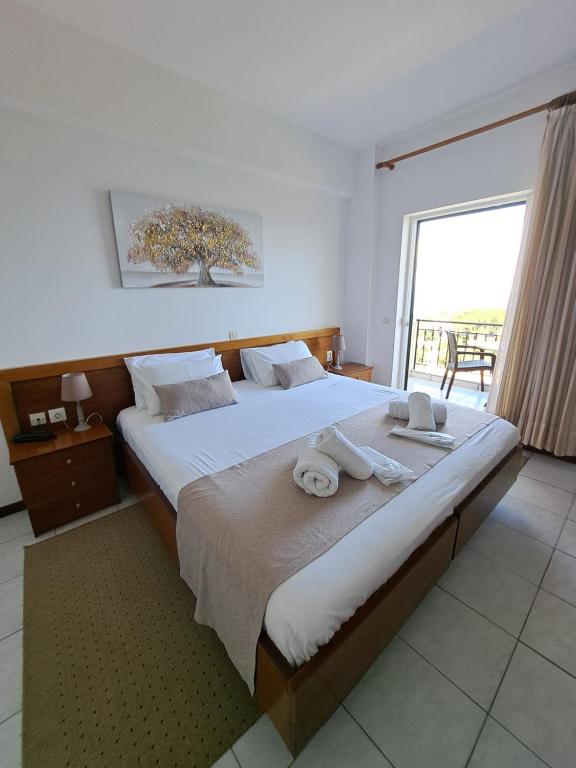 A bed or beds in a room at 75 Steps Apartments