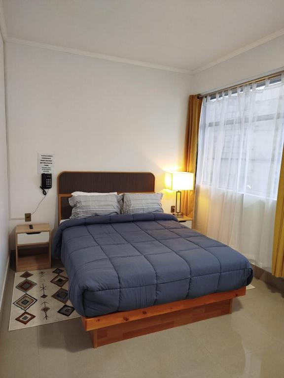 Postel nebo postele na pokoji v ubytování Hotel Ming Shen