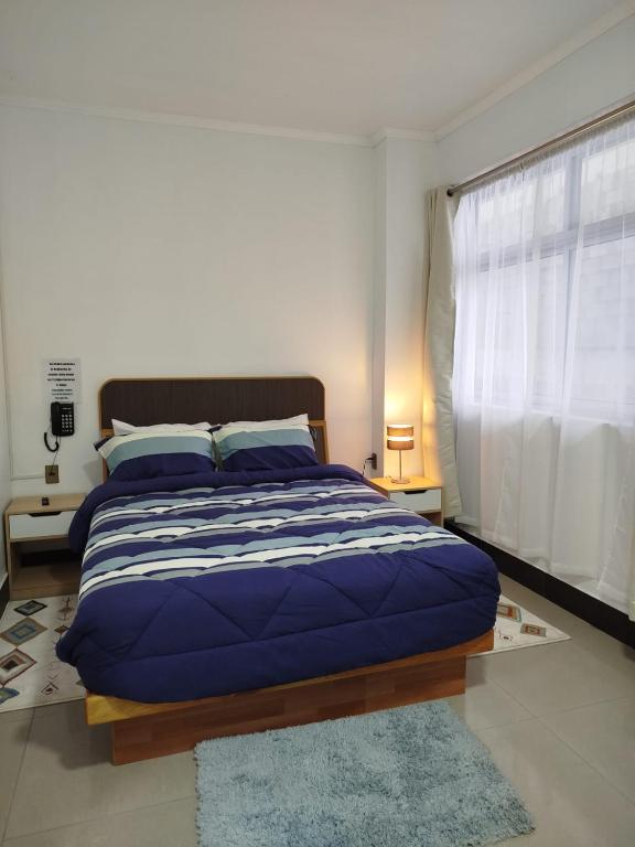 Postel nebo postele na pokoji v ubytování Hotel Ming Shen