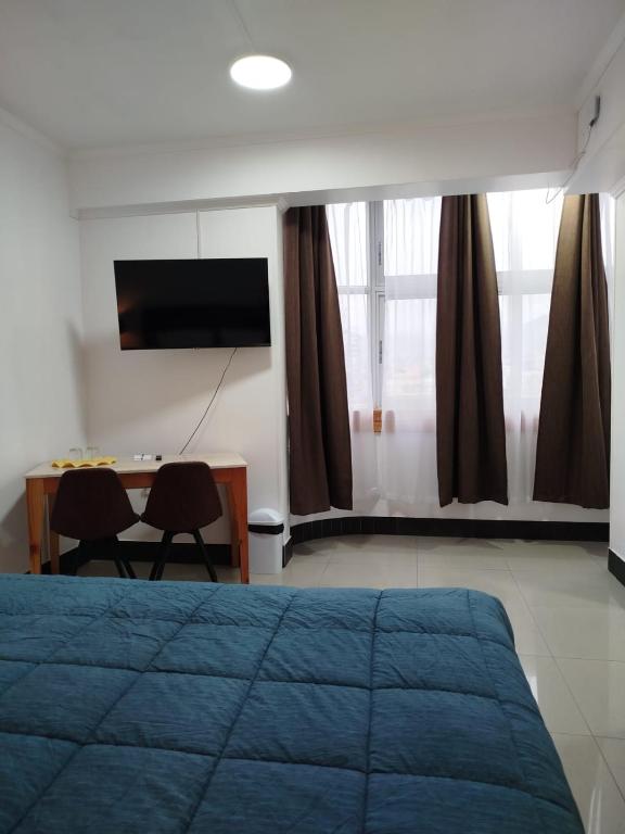 Postel nebo postele na pokoji v ubytování Hotel Ming Shen