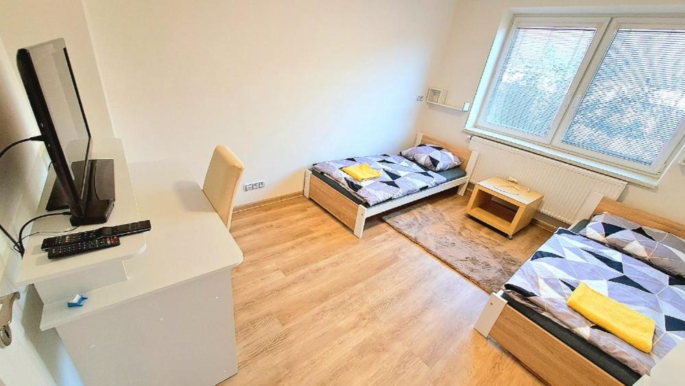 Postel nebo postele na pokoji v ubytování Na Jezérkách