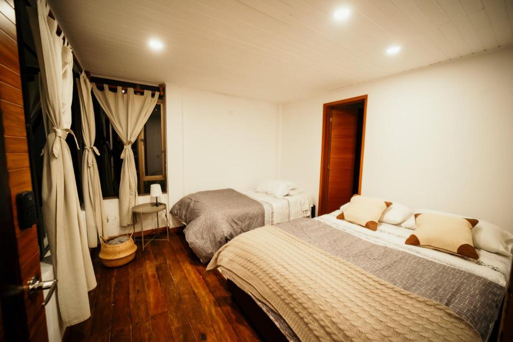 Postel nebo postele na pokoji v ubytování Suite campestre en Guatavita