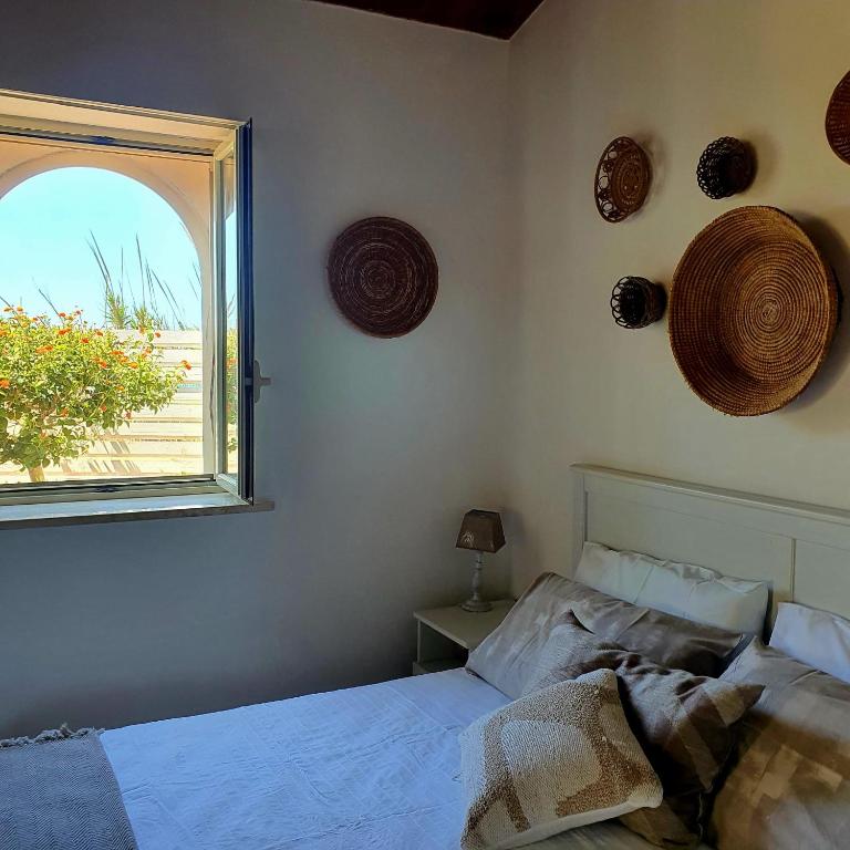 Postel nebo postele na pokoji v ubytování Agave Villa's Fronte Mare