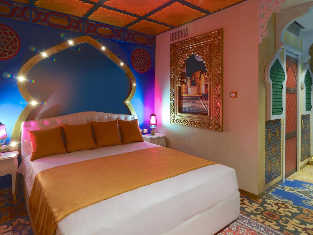 Postel nebo postele na pokoji v ubytování Gardaland Adventure Hotel