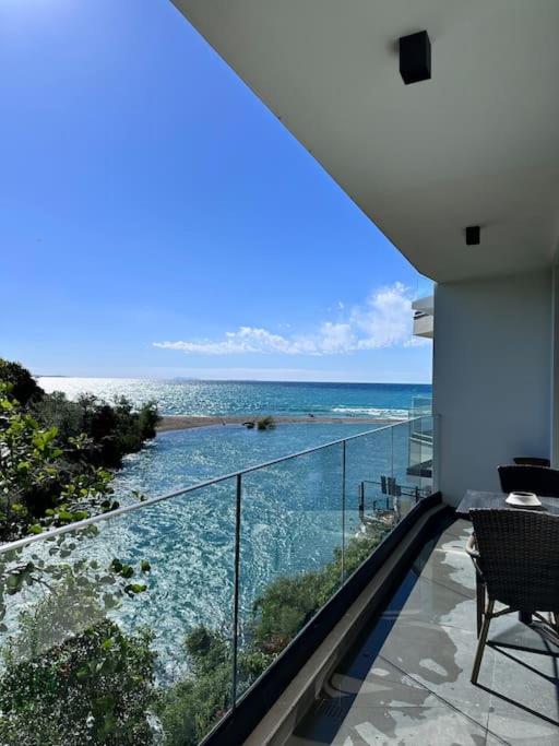 a view of the ocean from the balcony of a house at Lumi Residence Apartment 2 in Sarandë