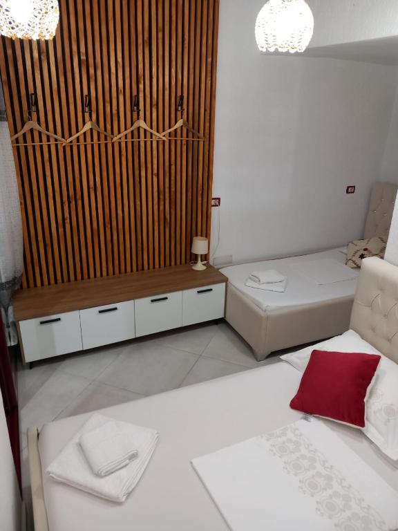 Postel nebo postele na pokoji v ubytování villa Heljos apartaments