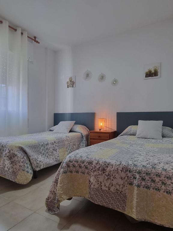 Posteľ alebo postele v izbe v ubytovaní Apartamento Cayetano