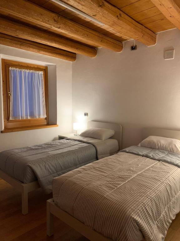 Postel nebo postele na pokoji v ubytování Casamia