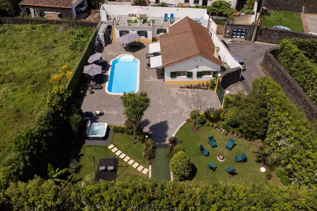 an aerial view of a house with a swimming pool at Quinta do Pastor - HOST & CHILL in Ribeira Grande