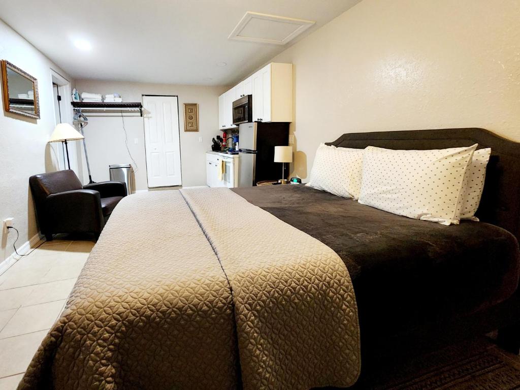 a bedroom with a large bed in a room at Cozy Studio! in Lakeland