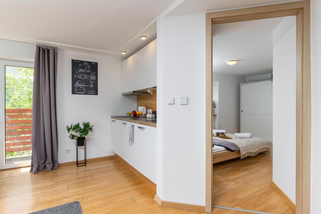 Posteľ alebo postele v izbe v ubytovaní Apartamenty Orla