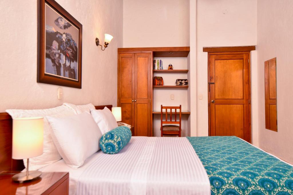 Giường trong phòng chung tại La Campana Hotel Boutique
