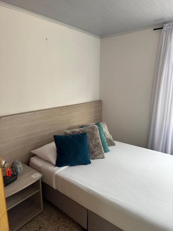 Postel nebo postele na pokoji v ubytování ZIVÁ HOSTAL