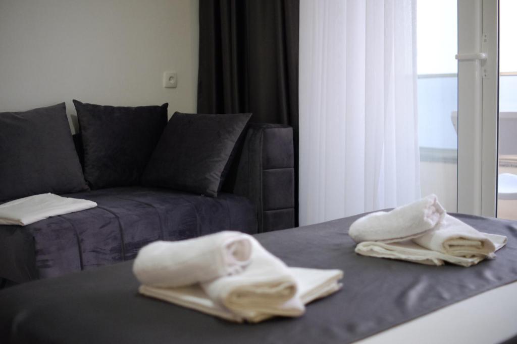Postel nebo postele na pokoji v ubytování Molla Apartments