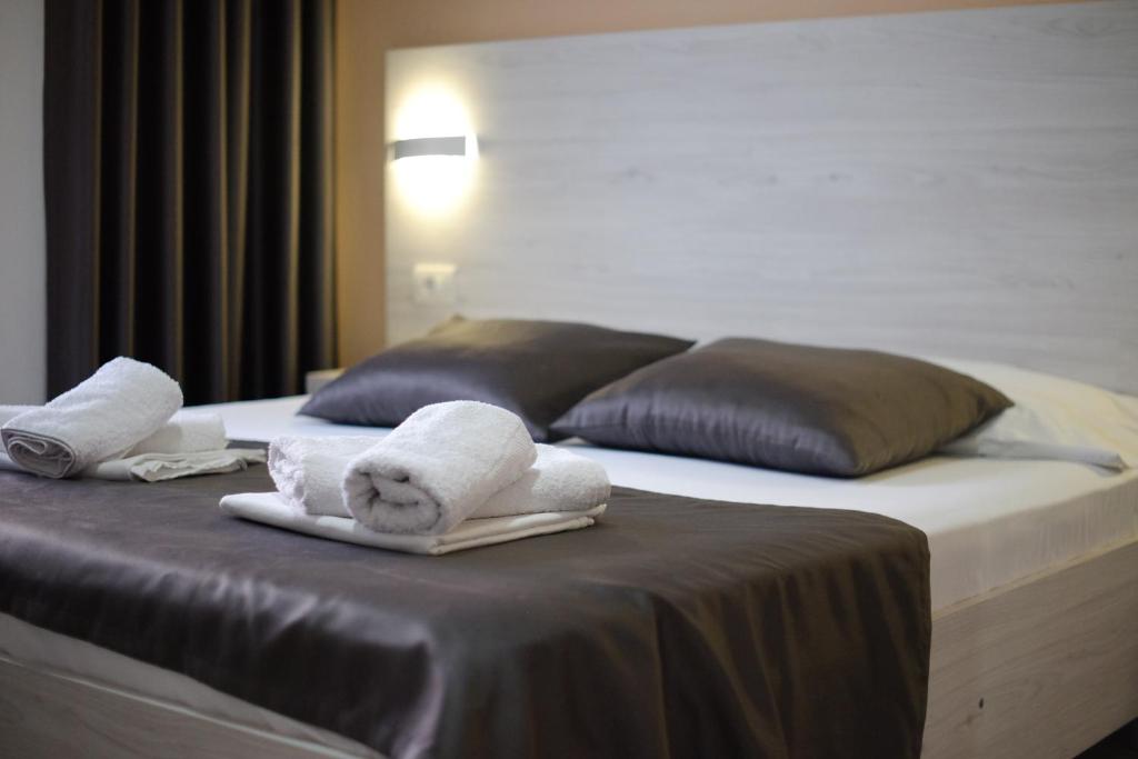 Postel nebo postele na pokoji v ubytování Molla Apartments