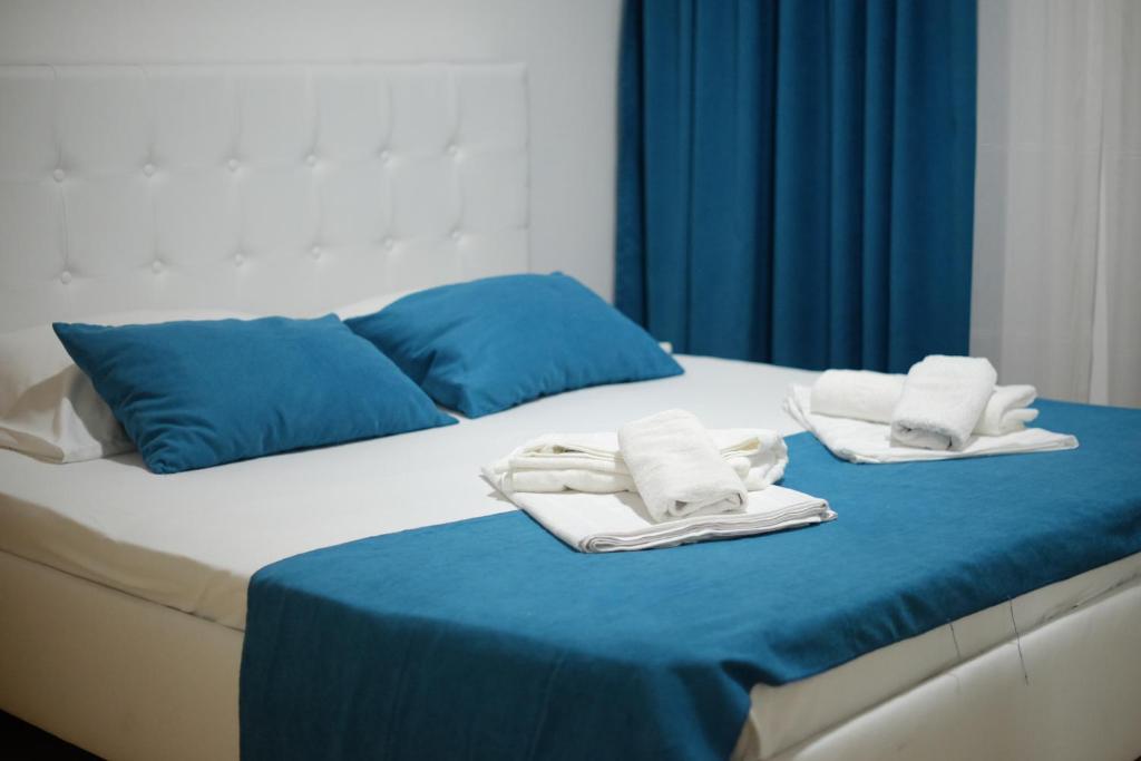 Postel nebo postele na pokoji v ubytování Molla Apartments