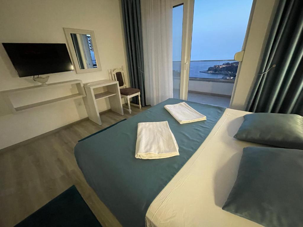 Postel nebo postele na pokoji v ubytování Molla Apartments
