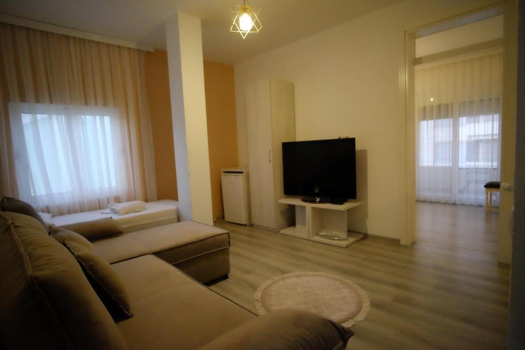 TV a/nebo společenská místnost v ubytování Molla Apartments