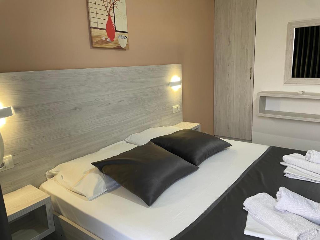 Postel nebo postele na pokoji v ubytování Molla Apartments