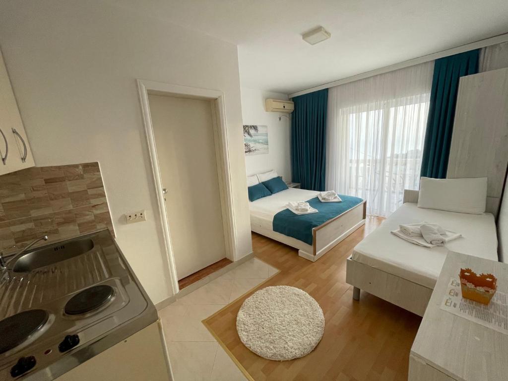 Postel nebo postele na pokoji v ubytování Molla Apartments