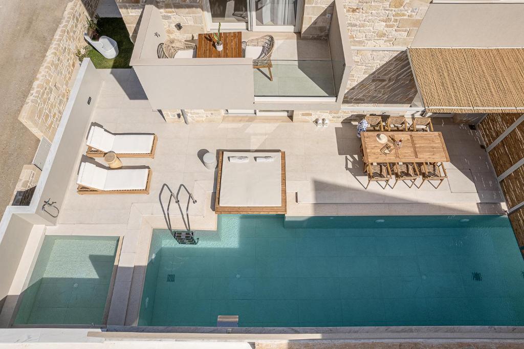 an overhead view of a swimming pool in a house at Pietra Di Sabbia Villas in Palaiochora