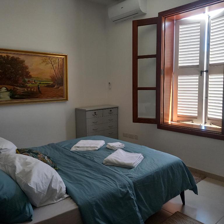Postel nebo postele na pokoji v ubytování Casa Nina Sliema Urban Residences