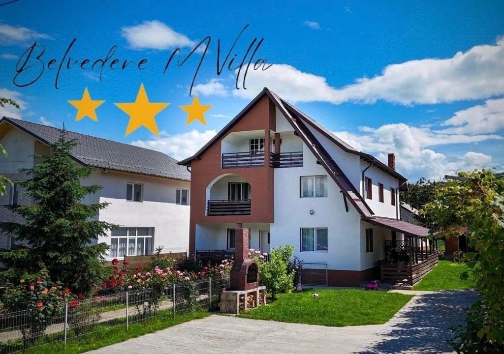 ein Haus mit Sternen darüber in der Unterkunft Casa M Belvedere in Călimăneşti