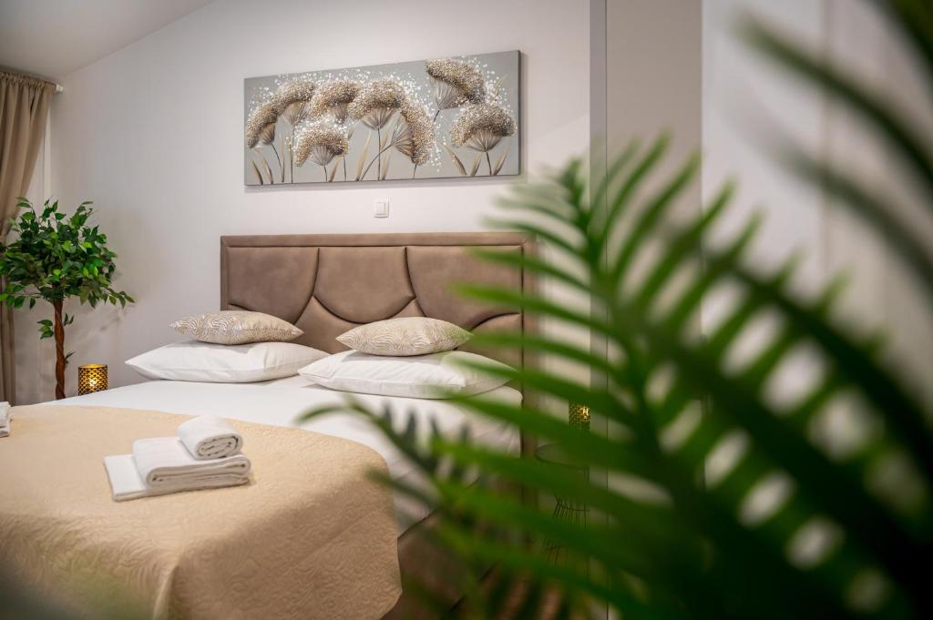 Postel nebo postele na pokoji v ubytování Apartmani Rita