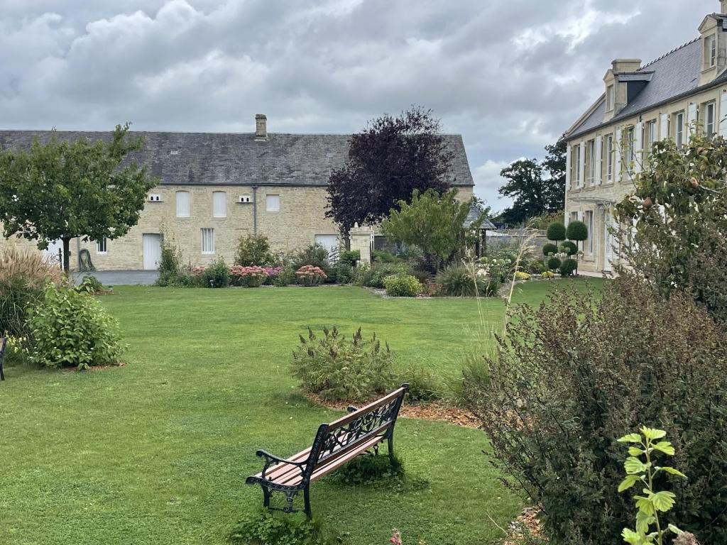 a park bench in the yard of a house at Aurefees in Ellon