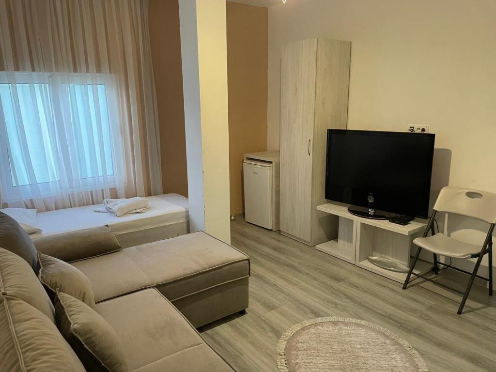 TV a/nebo společenská místnost v ubytování Molla Apartments