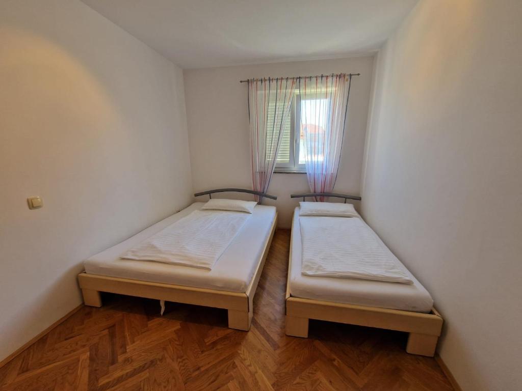 Posteľ alebo postele v izbe v ubytovaní Apartment Jozic
