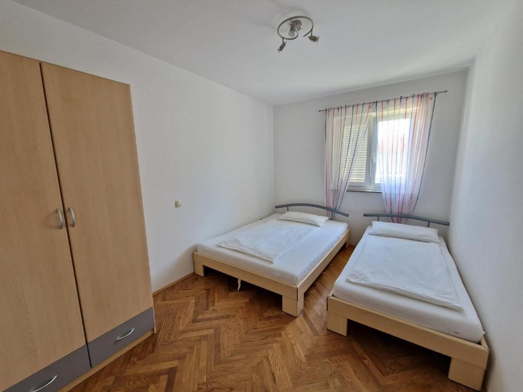 Posteľ alebo postele v izbe v ubytovaní Apartment Jozic