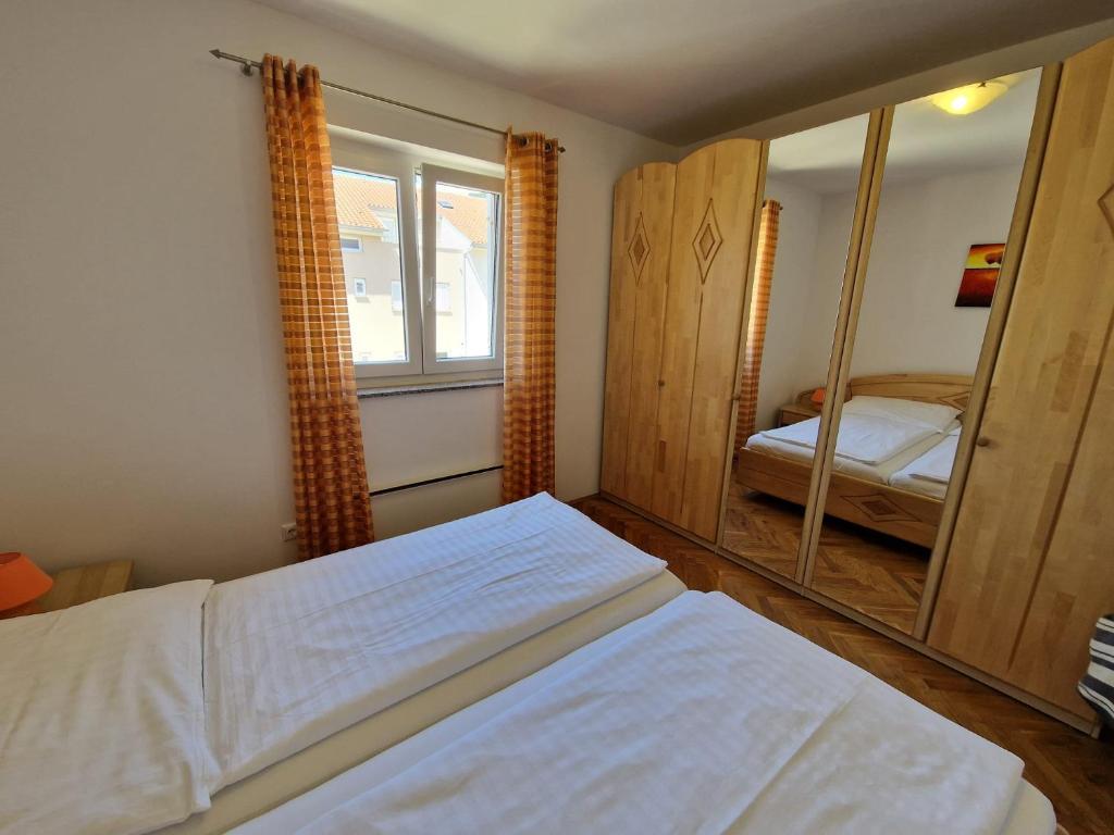 Posteľ alebo postele v izbe v ubytovaní Apartment Jozic