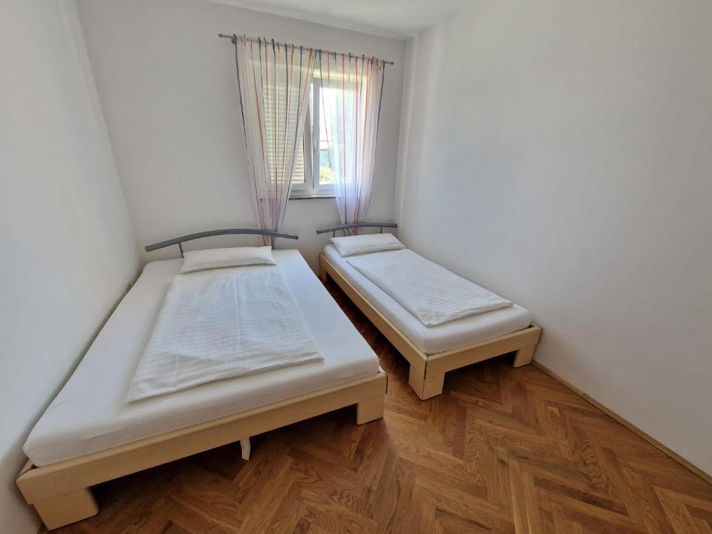 Posteľ alebo postele v izbe v ubytovaní Apartment Jozic