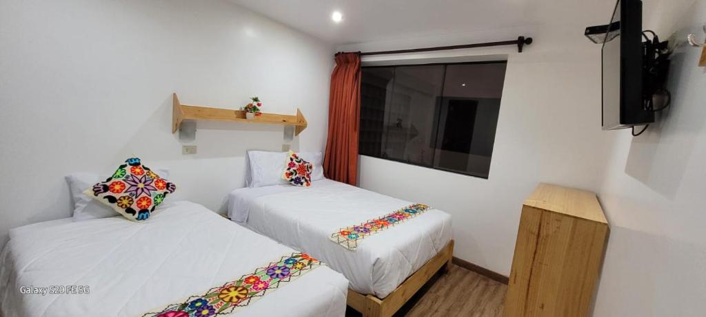 Postel nebo postele na pokoji v ubytování Hotel Ruta Amazónica Machupicchu