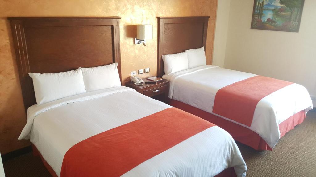 Postel nebo postele na pokoji v ubytování Hotel Don Ruben