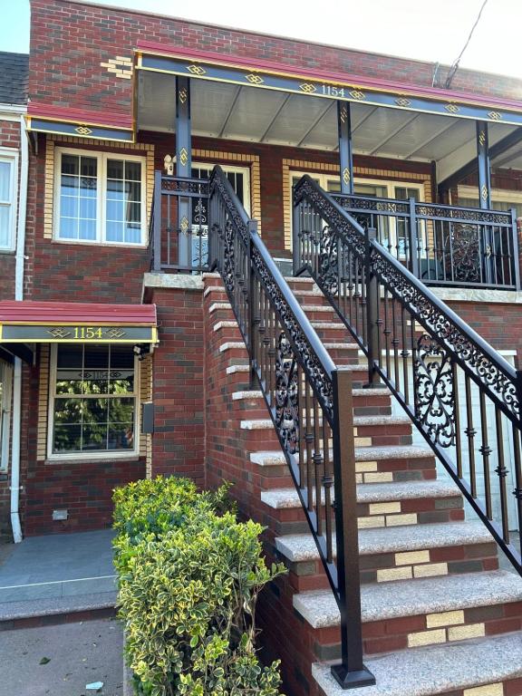 a staircase in front of a brick building at Cozy Canarsie Getaway Brooklyn NY in Brooklyn