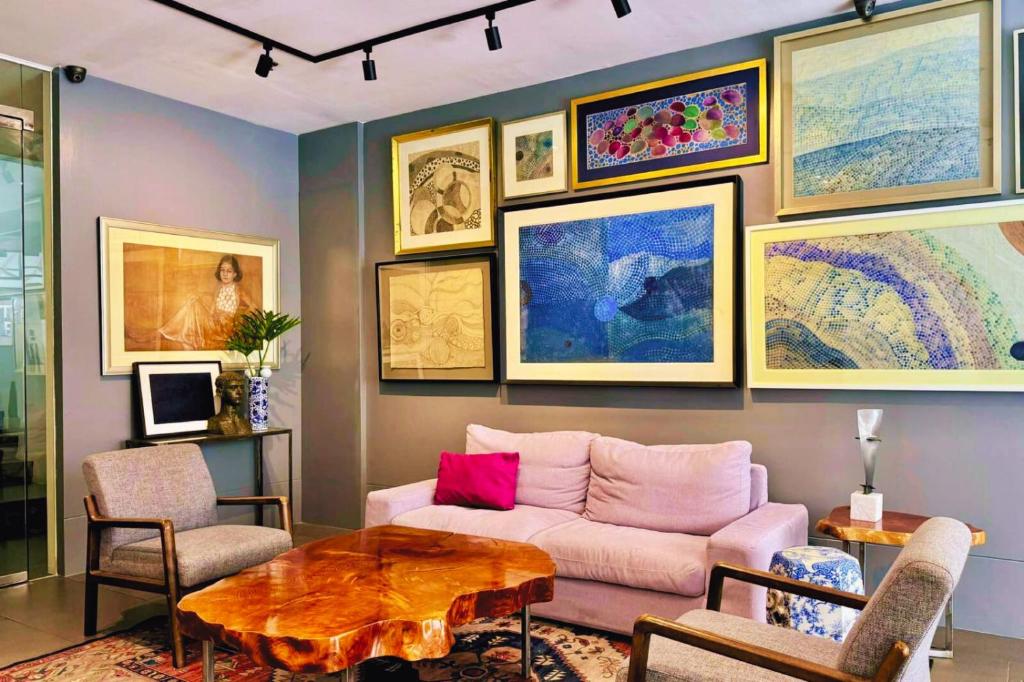 a living room with a couch and a table at Hotel Durban in Manila