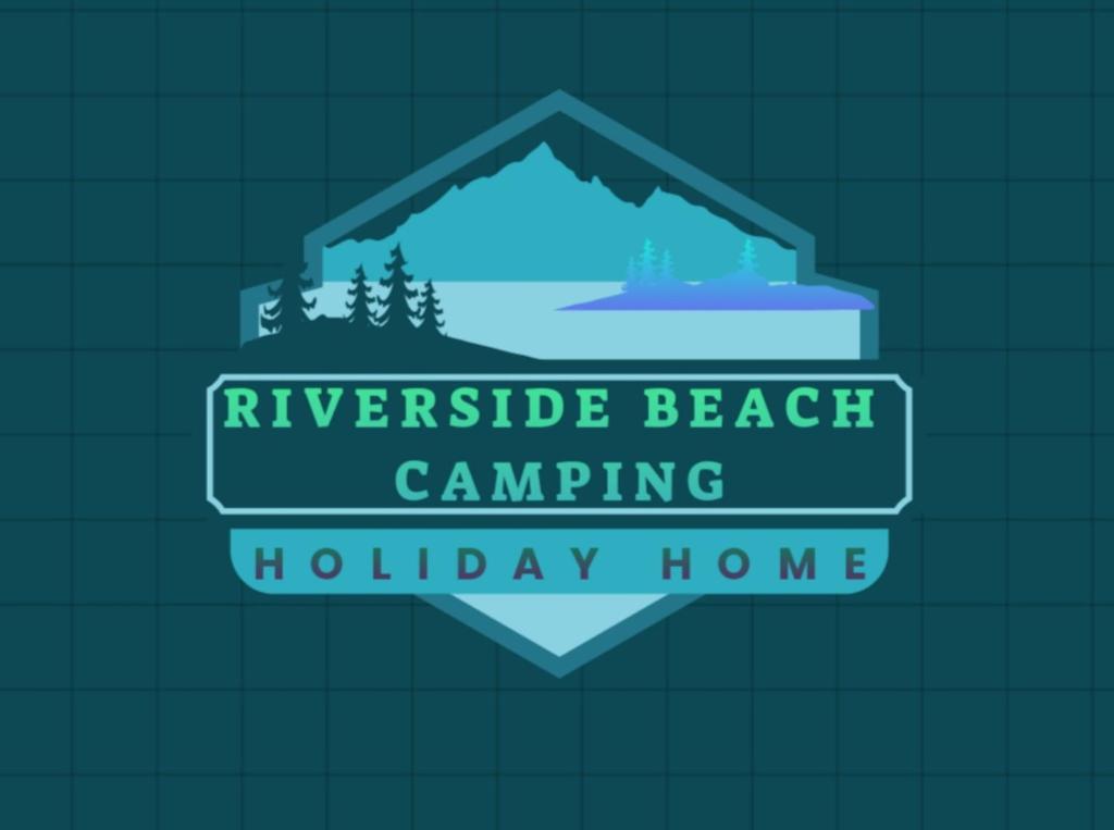 a sign that reads riverside beach camping holiday home at Holiday Riverside Beach Camping in Gol