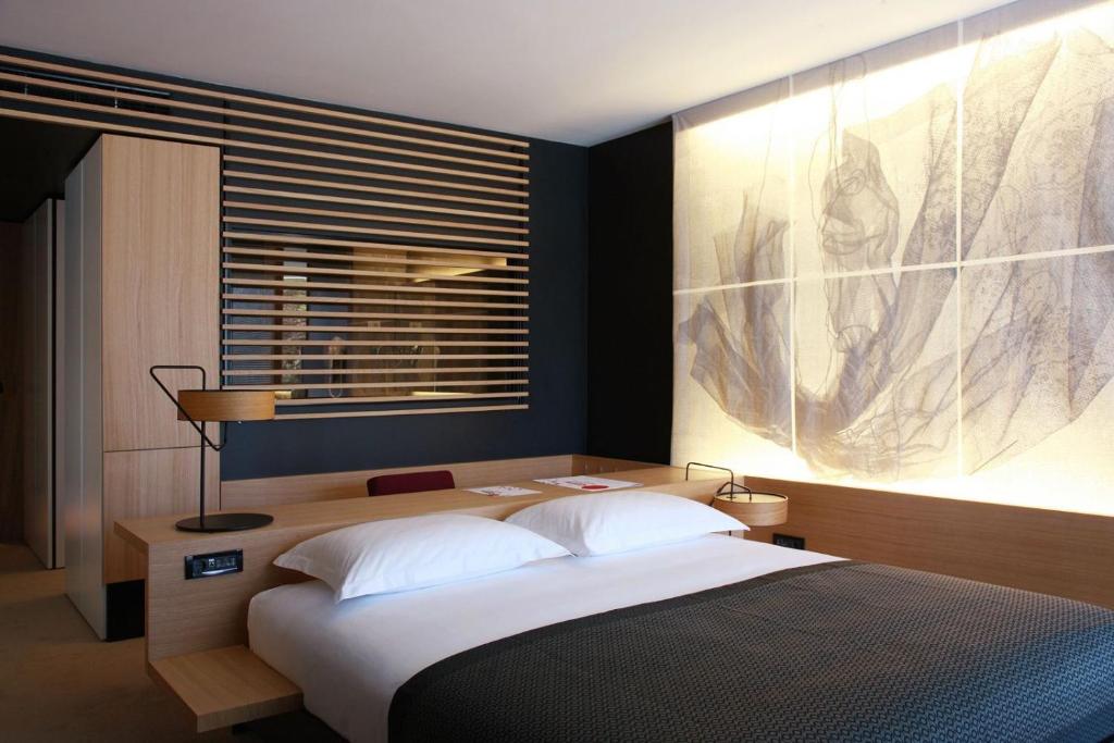 Ένα ή περισσότερα κρεβάτια σε δωμάτιο στο DAYSTAR Hotel