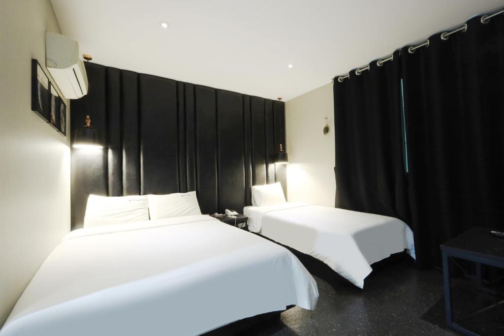 Postel nebo postele na pokoji v ubytování Ignis Hotel
